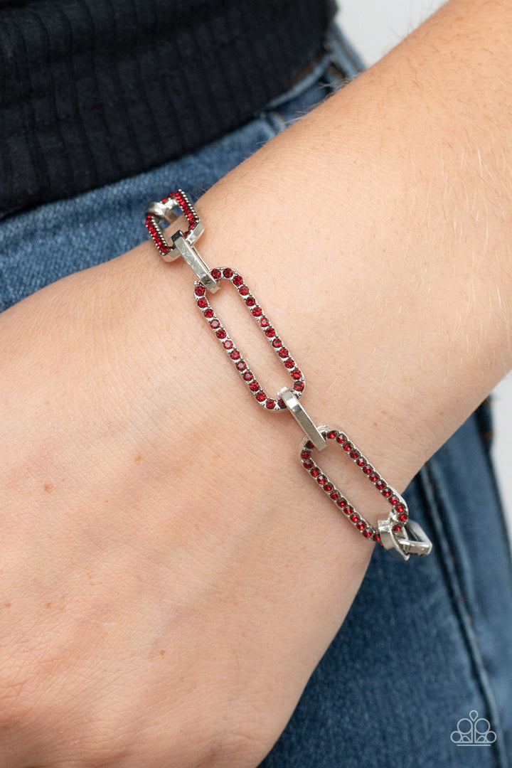 Still Not OVAL You - Red and Silver Bracelet - Paparazzi Accessories - Dotted in dainty red rhinestones, oblong silver frames link with shiny silver fittings around the wrist for a timeless twinkle. Features an adjustable clasp closure. Sold as one individual bracelet.