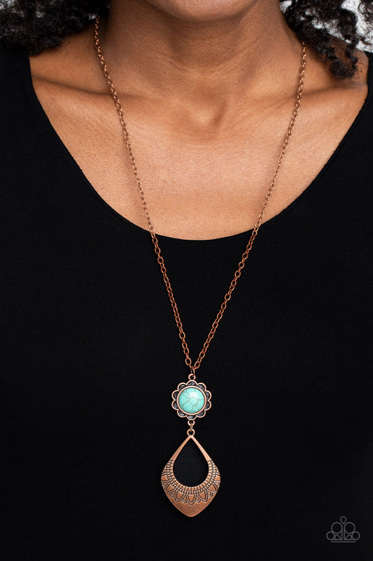 Stone TOLL - Copper and Turquoise Necklace - Paparazzi Accessories - An oversized turquoise stone, wrapped in a copper floral frame swings as the uppermost shape above an oversized, airy, copper spade-like frame creating a free-spirited finish. Stamped floral cutouts embellish along the lower curve of the teardrop-like frame for additional artisanal detailing.