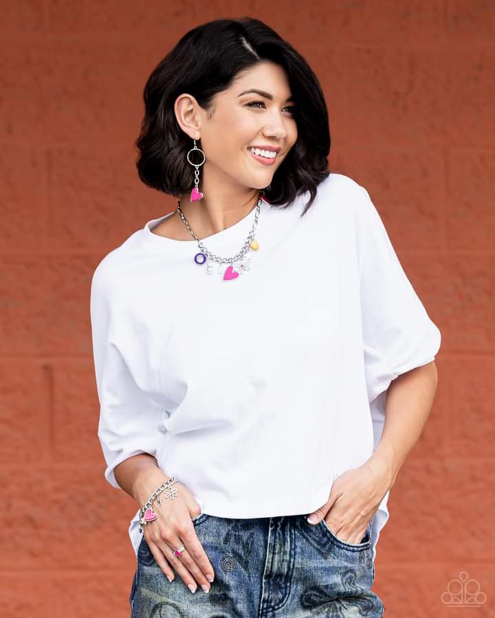 Sunset Sightings Fashion Fix Set - Multi Color Charm Jewelry - Paparazzi Accessories - Jewelry set includes one of each accessory: Living in CHARM-ony - Multi Necklace, Don't Miss a HEARTBEAT Pink Earrings, Turn Up the Charm - Multi Bracelet, Contemporary Charm - Pink Ring. The Sunset Sightings Collection features audacious, outside-the-box fashion.