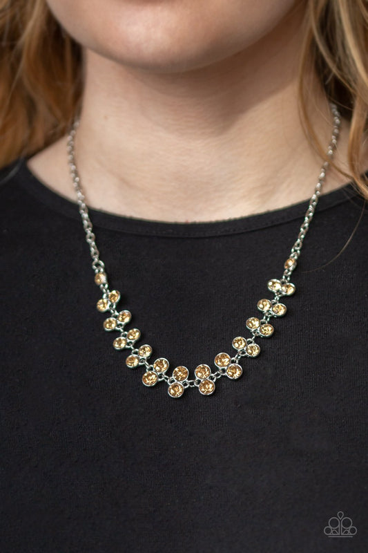Super Starstruck - Golden Topaz Necklace - Paparazzi Accessories - Golden topaz rhinestones below the collar of silver chain for a timeless look necklace. Features an adjustable clasp closure.