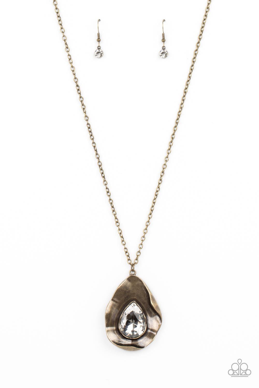 Surrealist Sparkle - Brass Necklace - Paparazzi Accessories - A warped brass frame gently folds around an oversized white teardrop gem center, resulting in a gritty yet glamorous pendant at the bottom of a lengthened brass chain.