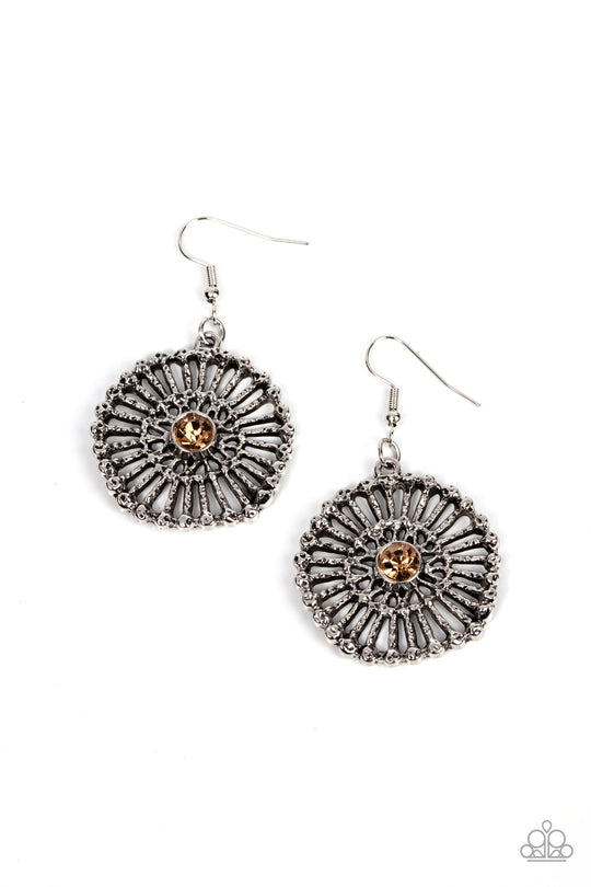 Tangible Twinkle - Brown and Silver Earrings - Paparazzi Accessories - Hammered silver spokes flare out from a golden topaz rhinestone center, resulting in a studded silver frame. Earring attaches to a standard fishhook fitting. Sold as one pair of earrings.