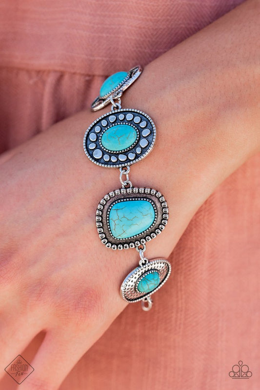 Taos Trendsetter - Blue Turquoise Stone Bracelet - Paparazzi Accessories - An earthy collection of irregular shaped turquoise stones are each pressed into distinctive antiqued silver frames. Each frame showcases a unique pattern of studded and dotted texture resulting in an artisanal vintage vibe as it falls around the wrist.