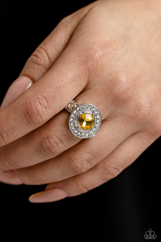 Targeted Timelessness - Yellow and Silver Ring - Paparazzi Accessories - Featuring a pronged silver fitting, an oversized yellow gem sits atop a radiant ring of glassy white rhinestones for a timeless fashion.