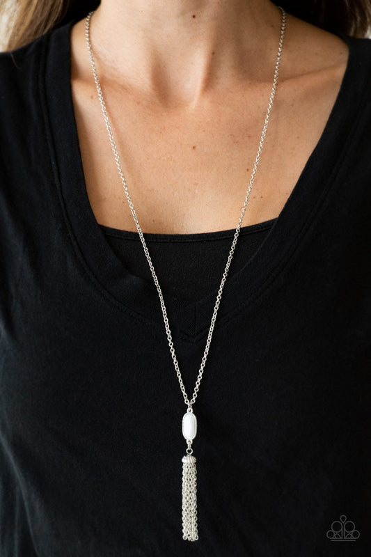Tassel Tease - White and Silver Necklace - Paparazzi Accessories - Swinging from a lengthened silver chain, a faceted white bead gives way to a shimmery silver tassel for a whimsical look.