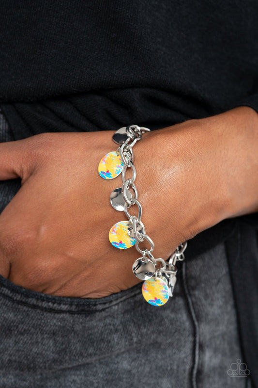 Teasingly Tie Dye - Yellow - Blue - Silver Bracelet - Paparazzi Accessories - Colorful tie dye print, a collection of colorful and dainty silver discs swings from a bulky silver chain around the wrist for a trendy finish. Features an adjustable clasp closure.