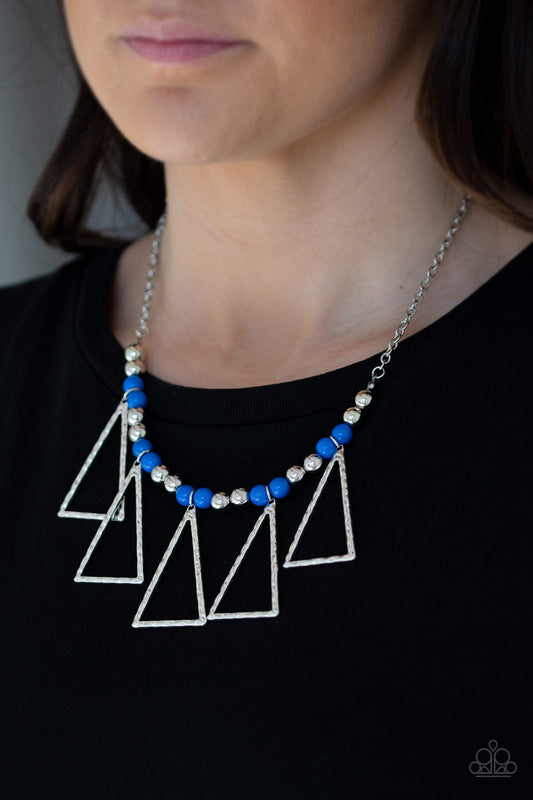 Terra Nouveau - Blue and Silver Necklace - Paparazzi Accessories - Shiny silver and refreshing blue beads are threaded along an invisible wire below the collar. Hammered triangular frames swing from the bottom of the colorful compilation, creating an artistic fringe. Features an adjustable clasp closure.