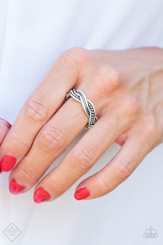 Texture Tango - Silver Fashion Ring - Paparazzi Accessories - Mismatched textures, ribbons of antiqued silver bands braid across the finger for a tribal inspired look. Features a dainty stretchy band, typically fit ladies ring sizes 5 - 9. 