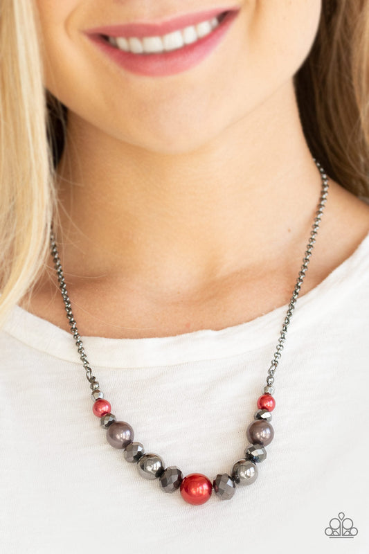 The Big-Leaguer - Red - Gunmetal Necklace - Paparazzi Accessories - A collection of pearly red, classic gunmetal, and crystal-like hematite beads are threaded along an invisible wire below the collar for a glamorous look. Features an adjustable clasp closure. Sold as one individual necklace.