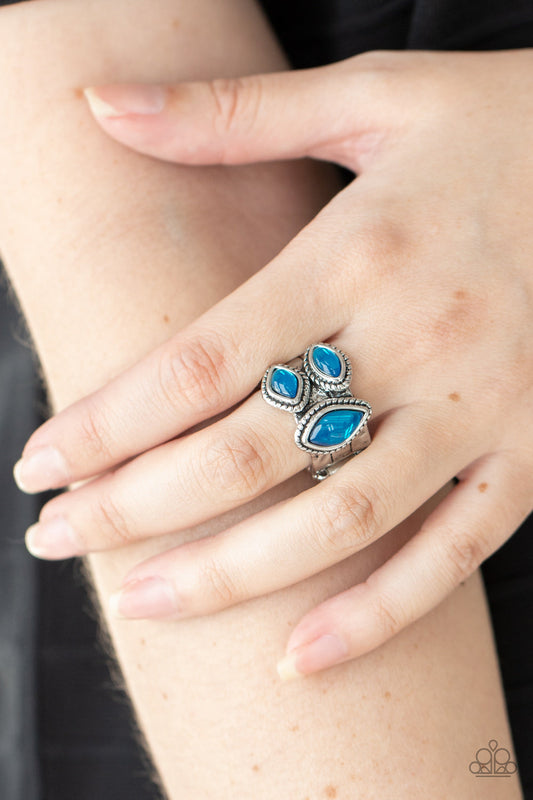The Charisma Collector - Blue and Silver Ring - Paparazzi Accessories - A trio of glassy blue marquise beads embellish the front of a hammered silver band etched in faux layers, creating an ethereal display atop the finger. 