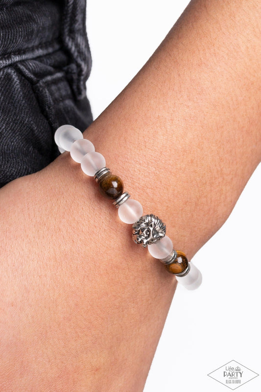 The Lions Share - Brown Lion Bracelet - Paparazzi Accessories - Infused with a silver lion charm, glassy white and energetic tiger's eye stones are threaded along a stretchy elastic band for a seasonal look. Sold as one individual bracelet.