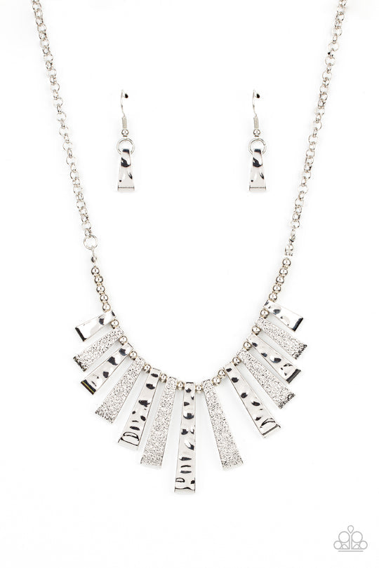 The Mane Course - Silver Necklace - Paparazzi Accessories - Rustic and shimmery hammered textures, flared silver frames alternate along an invisible wire below the collar, creating an edgy fringe at the bottom of a classic silver chain. Features an adjustable clasp closure.