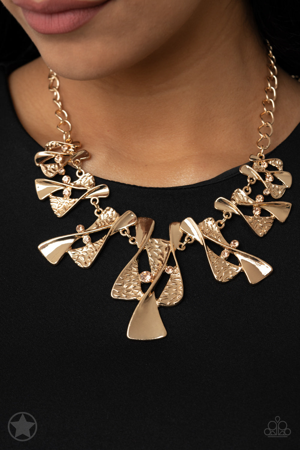 The Sands of Time - Gold - Peach Necklace - Paparazzi Accessories - Twisted gold hourglasses dance along a chunky gold chain with tiny peach rhinestones adding sparkling, elegant accents. The textured pieces add depth to this stylish necklace. 