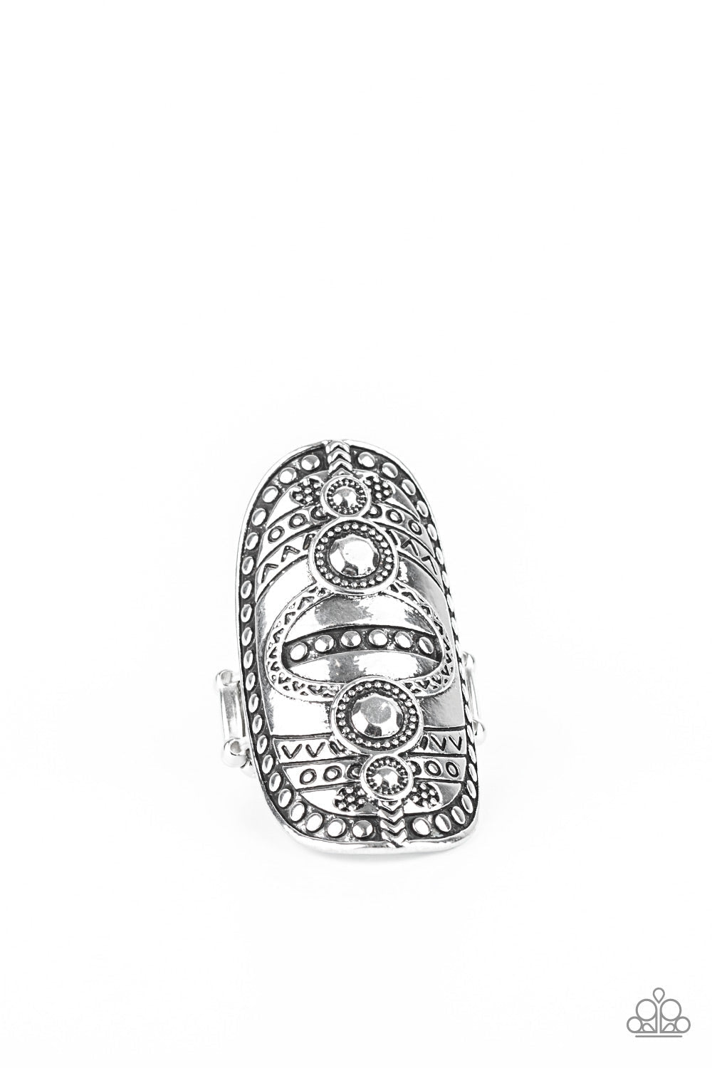 Tiki Trail - Silver Tribal Inspired Ring - Paparazzi Accessories - Studded and stamped in tribal inspired textures, an oversized silver frame folds around the finger for a rustically authentic look. Features a stretchy band for a flexible fit ring.