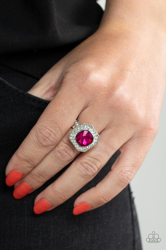 Title Match - Pink Gem and Silver Ring - Paparazzi Accessories - Bordered in a sparkly silver frame of glassy white rhinestones, an oversized pink gem adorns the finger for a timeless finish.