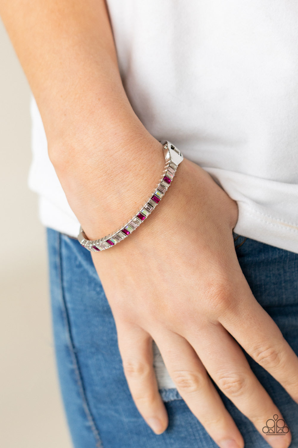 Toast to Twinkle - Pink Bling - Silver Hinge Closure Fashion Bracelet - Paparazzi Accessories - Regal emerald style cuts, a dainty row of pink and white rhinestones across the front of a silver cuff-like bangle for a timeless fashion bracelet.