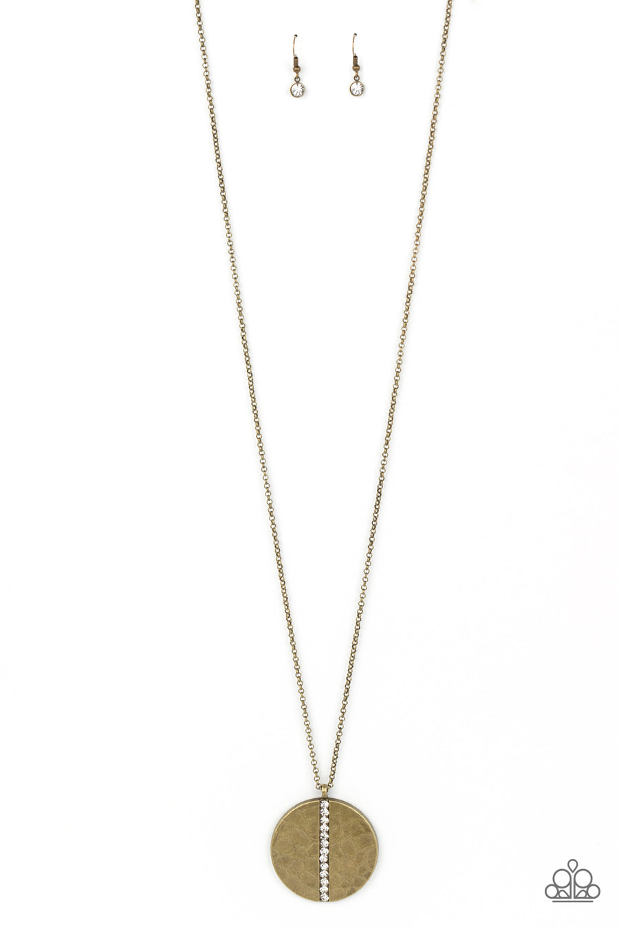 Token of My Gratitude - Brass Necklace - Paparazzi Accessories - An icy row of glittering white rhinestones is pressed into the center of a hammered brass disc, splitting the oversized pendant seemingly in two as it swings from the bottom of an extended brass chain for a dramatic effect.
