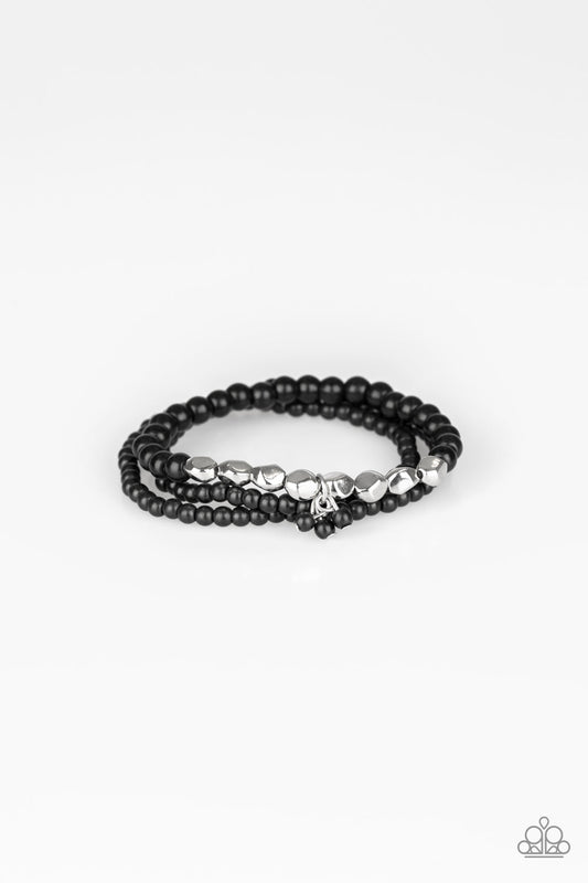 Tour de Tranquility - Black Stretchy Bracelets - Paparazzi Accessories - A collection of black stone beads and faceted silver beads are threaded along stretchy bands around the wrist, creating earthy layers. Sold as one set of three bracelets.