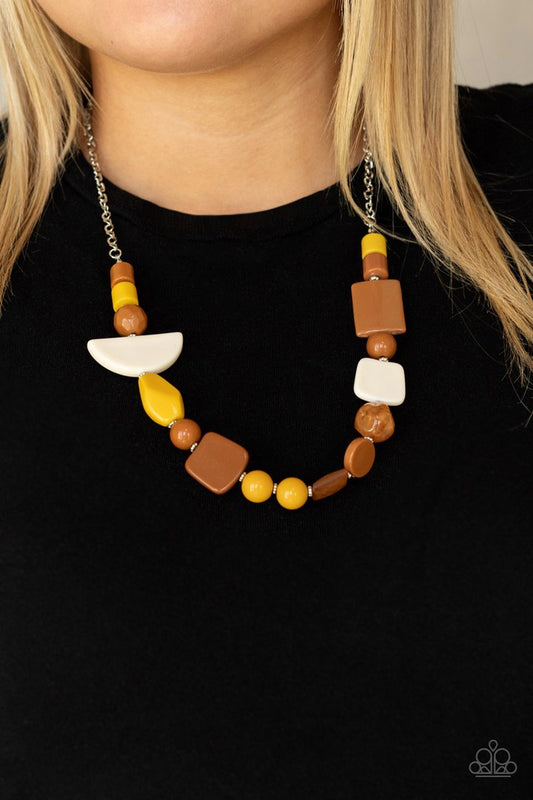 Tranquil Trendsetter - Yellow and Brown Necklace - Paparazzi Accessories - Featuring the rustic hues of Adobe, Mustard, and Soybean, mismatched acrylic and faux rock beads are haphazardly threaded along an invisible wire below the collar for an abstract artisan vibe. Features an adjustable clasp closure.