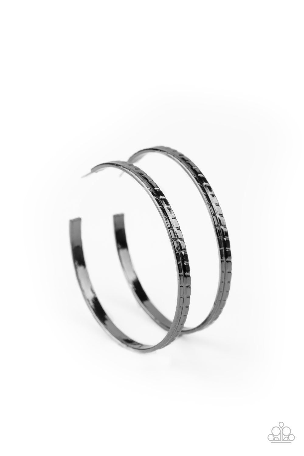 TREAD All About It - Black - Gunmetal Hoop Earrings - Paparazzi Accessories - Etched and embossed in a tread-like pattern, an oversized gunmetal hoop curls around the ear for an edgy look. Earring attaches to a standard post fitting. Hoop measures approximately 2 1/4" in diameter. Sold as one pair of hoop earrings.
