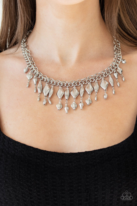 Trinket Trade - Silver Fashion Necklace - Paparazzi Accessories - A mismatched collection of silver beaded tassels dangle from the bottom of two interconnecting silver chains, creating a noisy fringe below the collar.