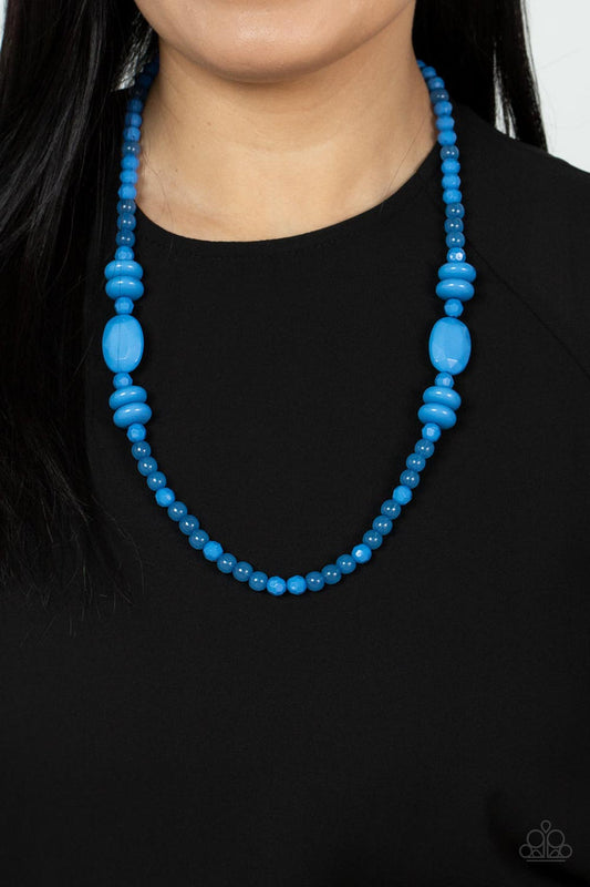 Tropical Tourist - Blue Acrylic Necklace - Paparazzi Accessories - Varying in size, shape, and opacity, a refreshingly blue collection of cloudy and solid acrylic beads drapes across the chest for a playful pop of color. Features an adjustable clasp closure.