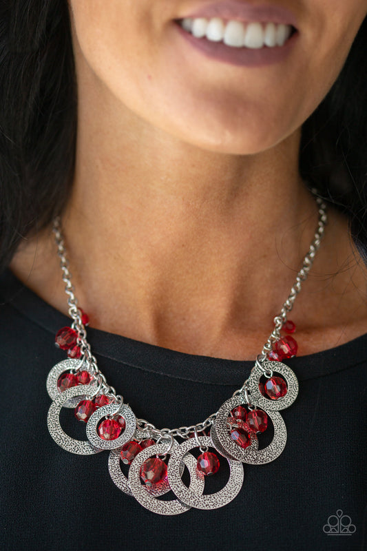 Turn It Up - Red and Silver Necklace - Paparazzi Accessories - A collection of Samba crystal-like beads and hammered silver hoops dangle from the bottom of a shimmery silver chain, creating a noise-making fringe necklace.