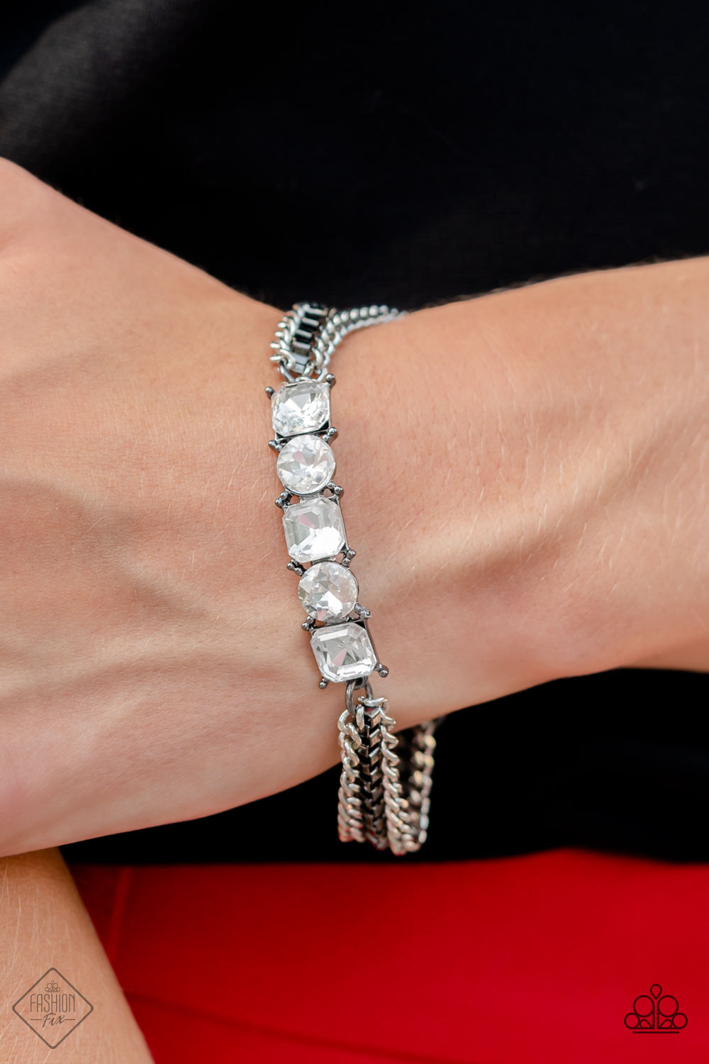 Tyrant Treasure - Black and Silver Chain Bracelet  - Paparazzi Accessories - A gritty mix of classic silver and gunmetal box-chains stem from a row of faceted white gems, pressed into circular and square gunmetal frames, creating edgy layers around the wrist. Features an adjustable clasp closure. Sold as one individual bracelet.
