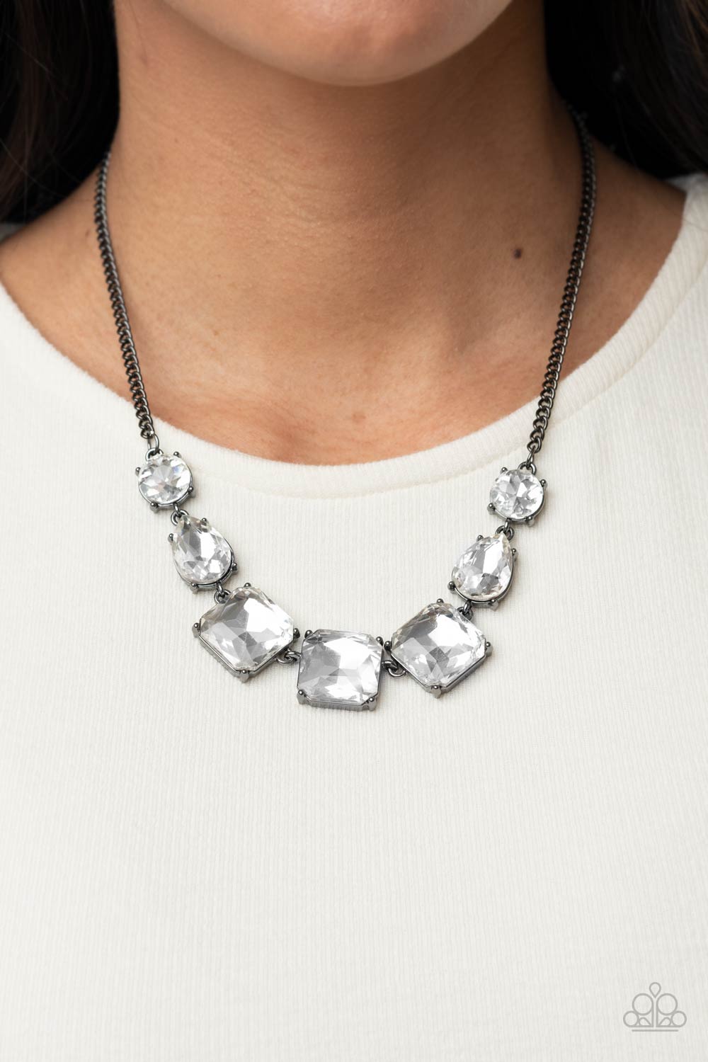 Unfiltered Confidence - Black - Gunmetal Gem Necklace - Paparazzi Accessories - A trio of brilliant white square cut gems encased in classic gunmetal fittings takes center stage. Teardrop and round gems link to a gunmetal chain on either side of the trio for a striking display below the collar. Features an adjustable clasp closure. Sold as one individual necklace.