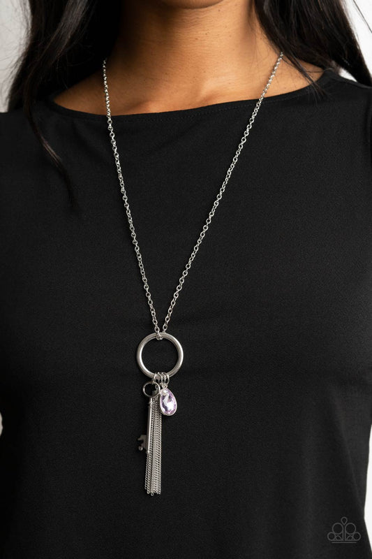 Unlock Your Sparkle - Purple and Silver Necklace - Paparazzi Accessories - A purple teardrop gem, silver key, dainty crystal-like bead, and shimmery silver chain tassel swings from the bottom of a silver ring at the bottom of a lengthened silver chain, creating a whimsically tasseled display. Features an adjustable clasp closure.  Sold as one individual necklace.  Bejeweled Accessories By Kristie