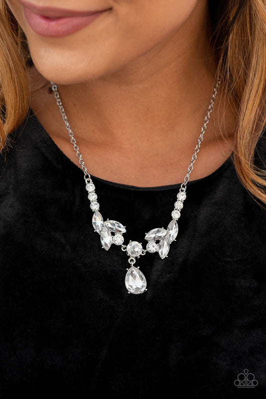Unrivaled Sparkle White and Silver Necklace - Paparazzi Accessories - Tiers of white rhinestone encrusted frames delicately link below the collar, giving way to an oversized white teardrop rhinestone pendant for a timeless finish. Features an adjustable clasp closure. Sold as one individual necklace.