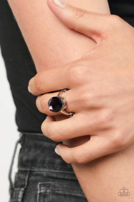 Updated Dazzle - Purple and Silver Ring - Paparazzi Accessories - A stunning faceted plum gem, set in edgy pronged fittings, creates a glamorous show-stopping centerpiece atop sleek silver bands.