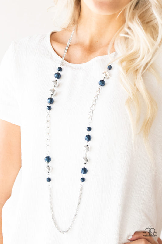 Uptown Talker - Blue and Silver Fashion Necklace - Paparazzi Accessories - Varying in size, pearly blue and oversized silver beads give way to sections of bold silver chain. Layers of silver chains drape across the bottom of the design for a flawless finish. Features an adjustable clasp closure. Sold as one individual necklace.