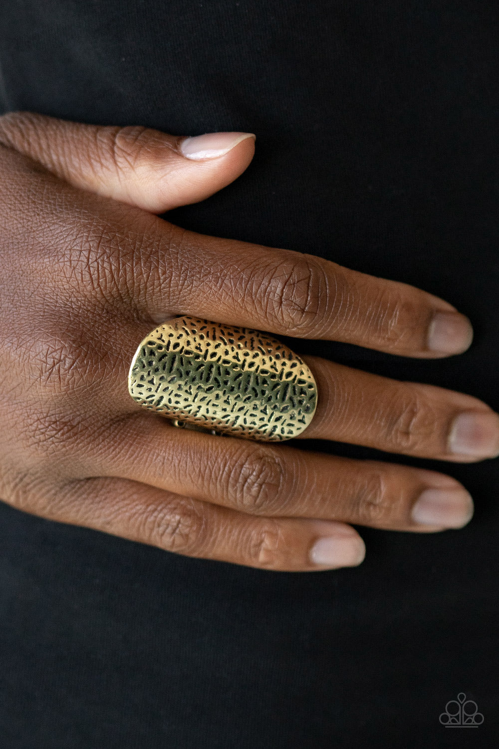 Urban Glyphs - Brass Ring - Paparazzi Accessories - Bejeweled Accessories By Kristie - Thick brass frame is delicately hammered in an abstract antiqued pattern, creating a bold industrial inspired centerpiece. Features a stretchy band for a flexible fit. 