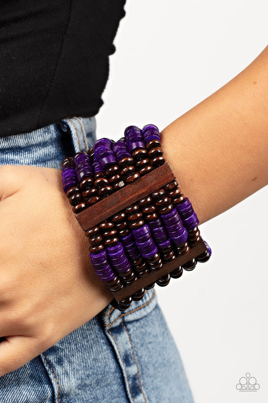 Vacay Vogue - Purple and Brown Bracelet - Paparazzi Accessories - Held together by rectangular wooden frames, rows of brown wooden and distressed purple discs are threaded along stretchy bands around the wrist for a seasonal pop of color around the wrist. Sold as one individual bracelet.