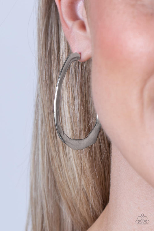 WARPED Speed - Silver Hoop Earrings - Paparazzi Accessories - Brushed in a high sheen silver finish, an irresistible J-shaped hoop is hammered and molded into a futuristic lure. Earring attaches to a standard post fitting. Hoop measures approximately 1 1/2" in diameter. Sold as one pair of hoop earrings.
