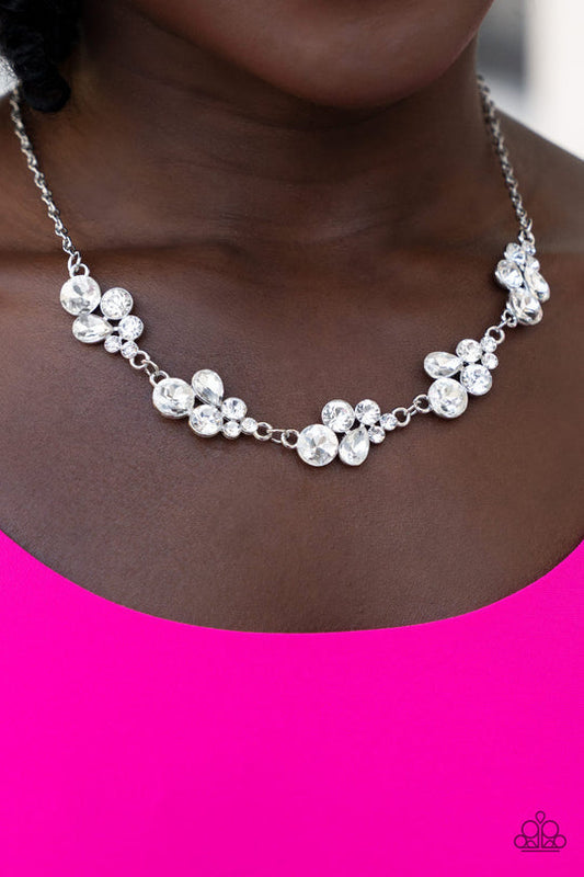 Wife of the Party - Silver Necklace - Paparazzi Accessories - Encased in sleek silver fittings, a bubbly collection of teardrop and round white rhinestones delicately connect into clustered frames below the collar for a sparkly, statement-making finish.