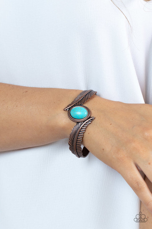 Wild Wild NEST - Blue and Copper Cuff Bracelet - Paparazzi Accessories - A refreshing turquoise stone dotted frame is nestled between two lifelike copper feathers, creating a free-spirited cuff around the wrist. Sold as one individual bracelet.