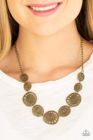 Your Own Free WHEEL - Brass Fashion Necklace - Paparazzi Accessories - Featuring airy stenciled patterns, shimmery brass discs link below the collar for a whimsical asymmetrical look.