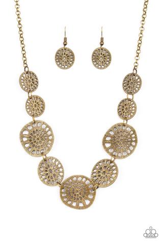 Your Own Free WHEEL - Brass Fashion Necklace - Paparazzi Accessories - Featuring airy stenciled patterns, shimmery brass discs link below the collar for a whimsical asymmetrical look.